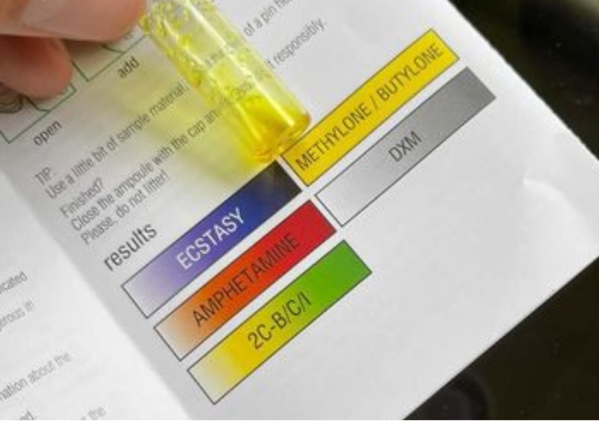 Image of a EZ Ecstasy test with cathinone. The reagent has gone bright yellow.