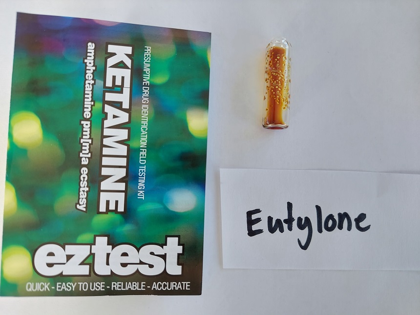 EZ Ketamine reagent test showing the yellow result signifying eutylone