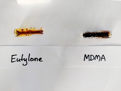 Image showing the results of the Narcocheck reagent test for cathinones. It goes dark yellow-brown in the presence of eutylone and dark blackish purple in the presence of MDMA