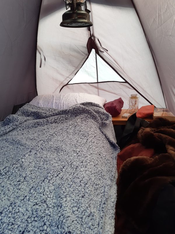 The inside of a 3-person tent with all of the warm, dry, snuggly things ever